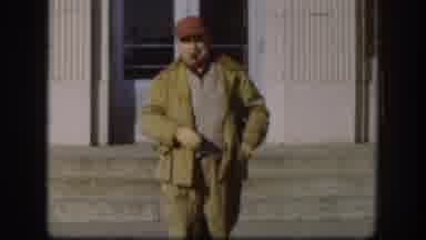 Kansas USA (1958): Male Smoking A Cigar While Walking And Smiling