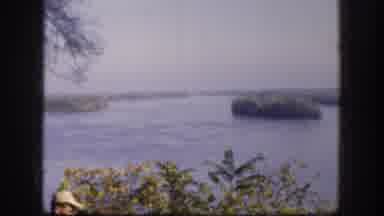 Kansas USA (1958): Two Men Looking Out Over Water Towards Islands