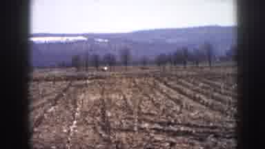 Nebraska USA (1958): Cars Driving On Road Men Working On Roof And Drinking From A
