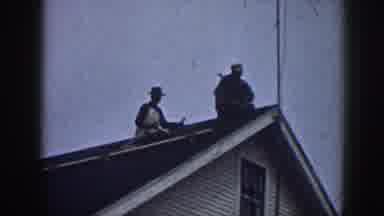 Nebraska USA (1958): Two Men Rooftop Cable Fixing Sunny Day Wooden House