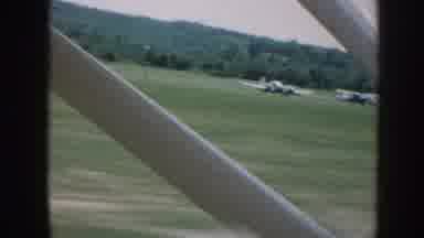 Nebraska USA (1958): An Airplane Taking Off In A Field, While Passing Other