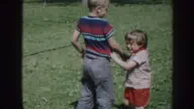 Nebraska USA (1958): Vintage Home Movie Clip Two Young Kids Horsing Around Outside
