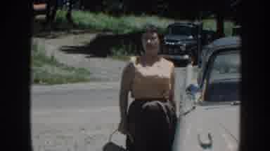 Nebraska USA (1958): Woman Walking Away From Vintage Car