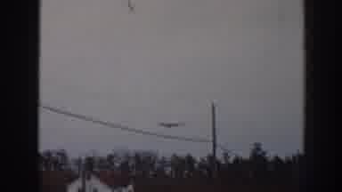 Nebraska USA (1958): A Blimp Moving Slowly Across The Sky With A Power Line In
