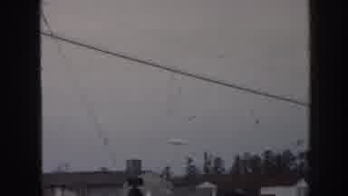 Nebraska USA (1958): View Of Zeppelin Airship Flying Over Trees And Houses On A