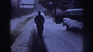 Nebraska USA (1958): Man Clearing A Snow Covered Sidewalk Using Shovel And
