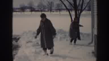 Nebraska USA (1958): Two Young People Outside Home Laughing Happily Stumbling