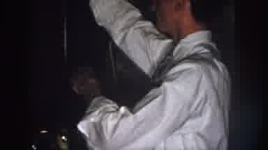 Nebraska USA (1958): A Man Rolls Up His Sleeves To Help A Woman Do The Dishes