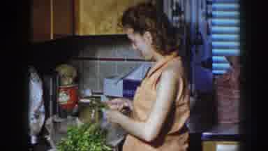 Nebraska USA (1958): Woman In The Kitchen Cutting Vegetables