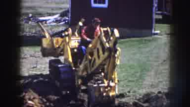 Nebraska USA (1958): Man Digs Yard With Backhoe On Cold Day