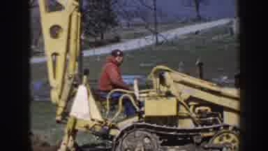 Nebraska USA (1958): A Person Working An Industrial Machine In The Middle Of A