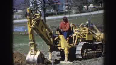 Nebraska USA (1958): Man Operating Tractor In Beautiful Outdoor Area And Also