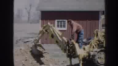 Nebraska USA (1958): On The Farm One Man Operating Small Bulldozer Digging Dirt