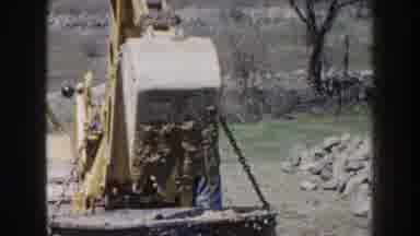 Nebraska USA (1959): A Piece Of Heavy Machinery Removing A Large Object From