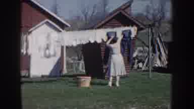 Nebraska USA (1959): Woman Hanging Her Washed Clothes In The Nature On A String