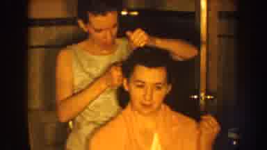 Nebraska USA (1959): Woman Wearing White Combs Hair Of Sitting Woman Wearing Pink