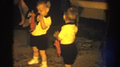 Nebraska USA (1959): Two Children Play With A Toy Car