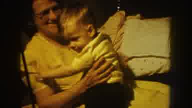 Nebraska USA (1959): Attentive Parents Taking Care Of Young Baby And Feeding With