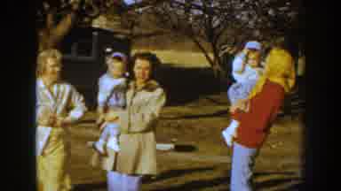 Nebraska USA (1959): Family Standing In Front Of Their House