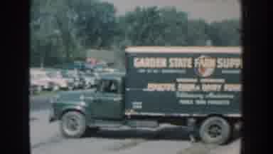 Nebraska USA (1959): External Shot Of Parked Green Vintage Garden Farm Supply