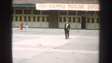 Nebraska USA-1959: Man Walks Past Neppco Poultry Expo Banner
