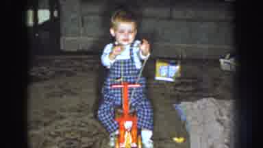 Nebraska USA (1959): The Baby Was Playing In The Toy Wood Cycle