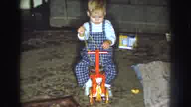 Nebraska USA (1959): Little Boy Playing With String M, Sitting Down On Bike ,