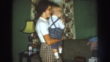 Nebraska USA (1959): Girl Holding A Baby While Dancing