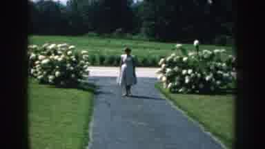 Nebraska USA (1959): The Girl Is Standing In Park At The Center Of The Path