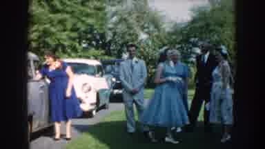 Nebraska USA (1959): Fashionable Dressed People Outside By Their Cars In The