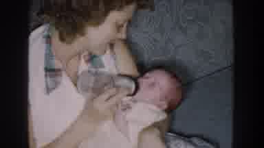Nebraska USA (1959): A Mother Is Feeding Her Baby With A Bottle Of Milk