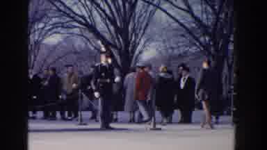 Washington DC USA (1960): People Walking Past A Soldier Parading With Gun Outside