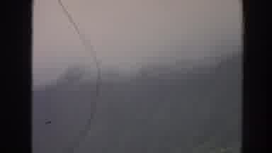 Hawaii USA (1961): Fog Covered Mountaintops,Men Carrying Pig Tied To Roasting