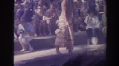 Hawaii USA (1961): Man And Woman Perform For Crowd Tending To The Fire