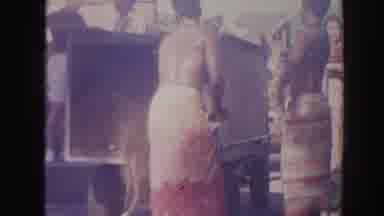 Hawaii USA (1961): People Shoveling Dirt Out Of A Box Onto The Ground