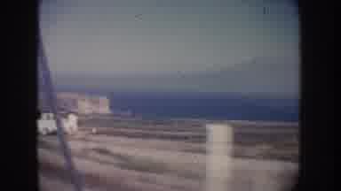 California USA (1962): White Truck Parked At Seaside Shed On A Bright Sunny Day
