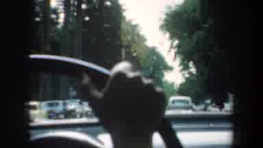 San Francisco California USA (1957): Driving Through The City With Cars Parked