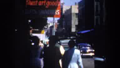 San Francisco California USA (1957): Street Porters Showing People Passing By
