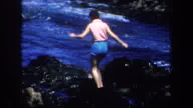 San Francisco California USA (1957): Woman Rocks Beach Sea Moments Joy