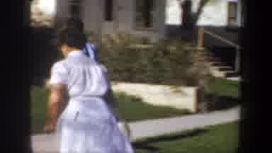 Portland Oregon USA (1957): Two People Running And Go To Sit In The Steps Another