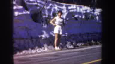 Portland Oregon USA-1957: Woman in White Poses by Stone Wall Roadside