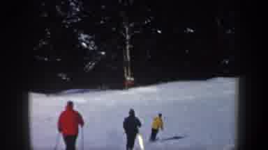 New Hampshire USA (1962): Three People Leisurely Skiing Downhill On A Sunny Winter