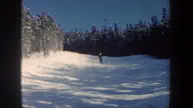 New Hampshire USA (1962): Shot Of Someone Skiing Along Hill Amongst Wintery