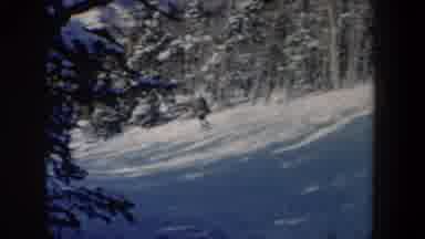 New Hampshire USA (1962): Two People Skiing Downhill On A Bright Sunny Winter Day