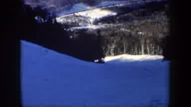 New Hampshire USA (1962): People Skiing Down A Snowy Hillside With Surrounding