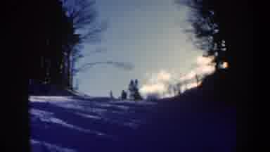 New Hampshire USA (1962): View Of People Skiing Downhill On A Sunny Winter Day