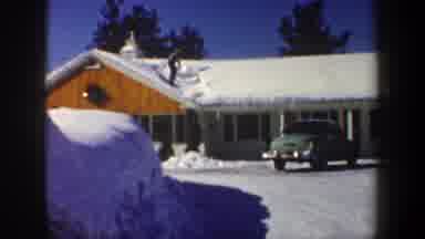 New Hampshire USA (1962): Man Shoveling Snow Off Roof