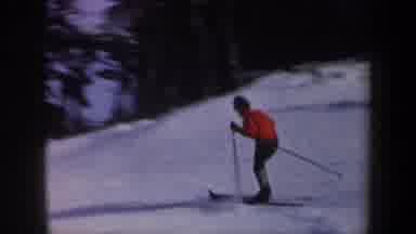 New York USA (1962): Skier Wearing Red Sweater Gracefully Glides Downhill On A