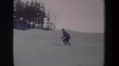 New York USA (1962): Person Skiing Down A Mountain Covered In Snow Skillfully And