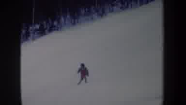 New York USA (1962): Professional Ski Player Sliding Down The Hill Slowly And